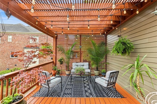 wooden deck with a pergola and an outdoor hangout area