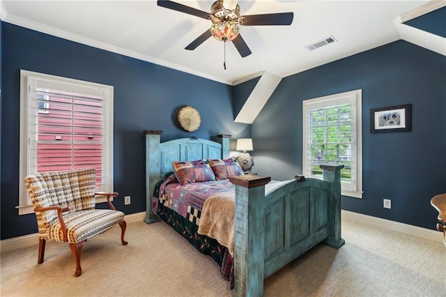 carpeted bedroom with baseboards, crown molding, and a ceiling fan