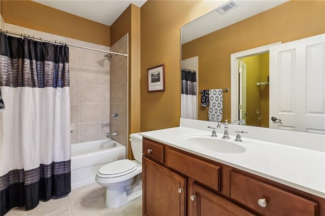 bathroom featuring toilet, tile patterned floors, vanity, and shower / bath combo