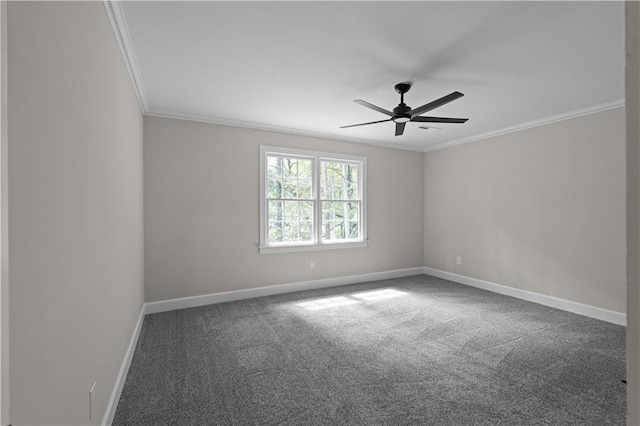 unfurnished room with ornamental molding, dark carpet, baseboards, and ceiling fan