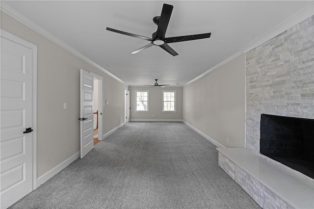 unfurnished living room with ornamental molding, a fireplace, carpet floors, and baseboards