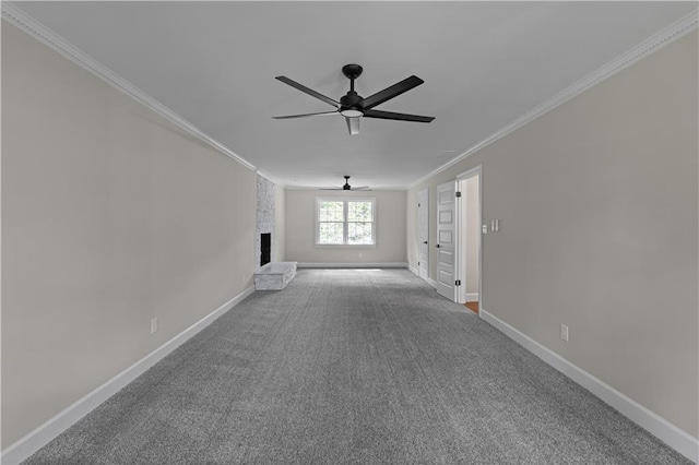 unfurnished living room with a fireplace, crown molding, a ceiling fan, carpet flooring, and baseboards