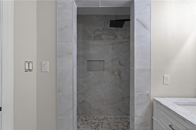 bathroom with vanity and a shower stall