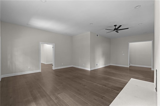 empty room with visible vents, baseboards, dark wood-style floors, ceiling fan, and recessed lighting