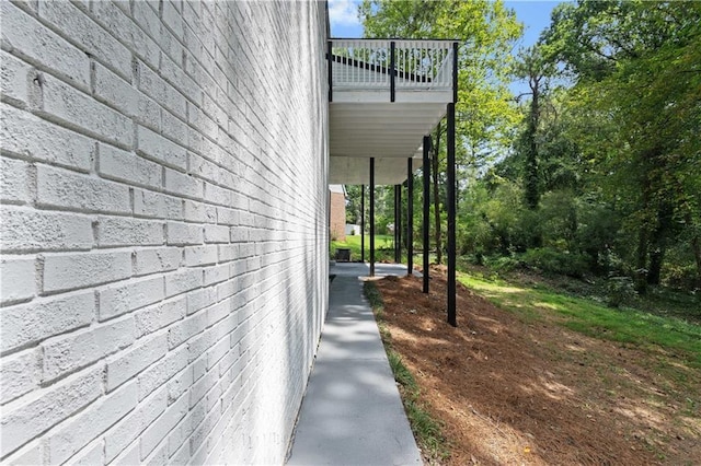 view of side of home with brick siding