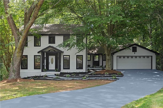 colonial inspired home with an attached garage