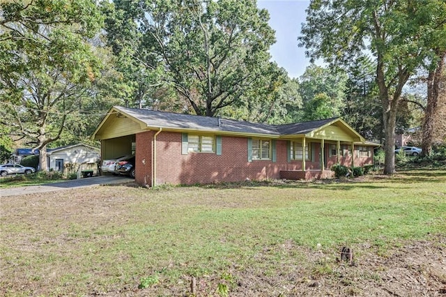 single story home featuring a front lawn and a carport