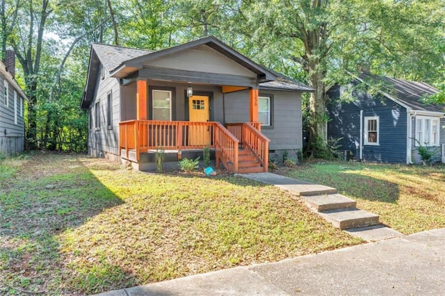 1336 Mcclelland Ave, Atlanta, GA 30344 - bungalow featuring covered porch and a front lawn