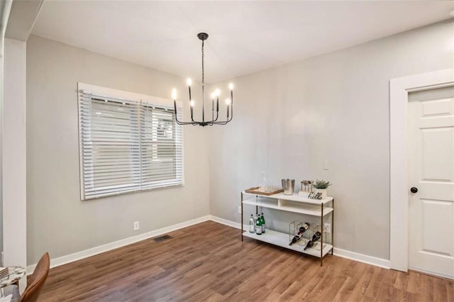 1336 Mcclelland Ave, Atlanta, GA 30344 - dining area featuring a chandelier and wood finished floors