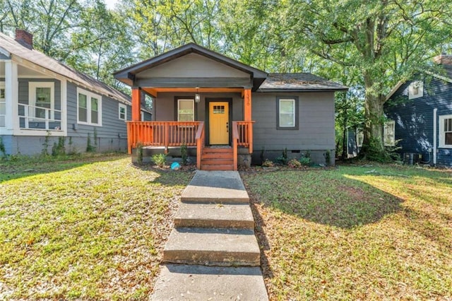 1336 Mcclelland Ave, Atlanta, GA 30344 - bungalow with covered porch, crawl space, and a front lawn