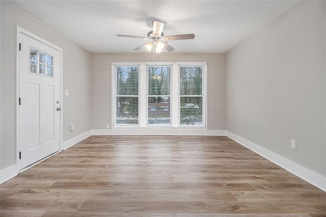 entrance foyer with ceiling fan and light hardwood / wood-style floors