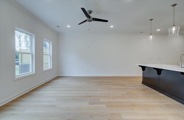 interior space with ceiling fan and light wood-type flooring