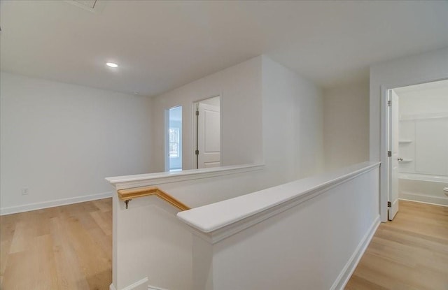 hall with light wood-type flooring