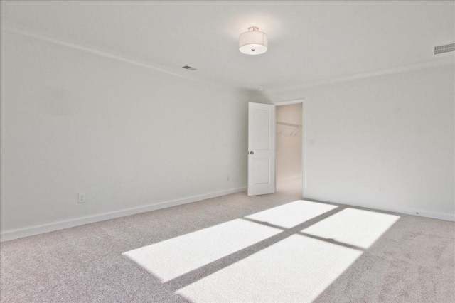 unfurnished room with light carpet