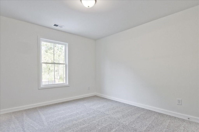 unfurnished room with carpet floors