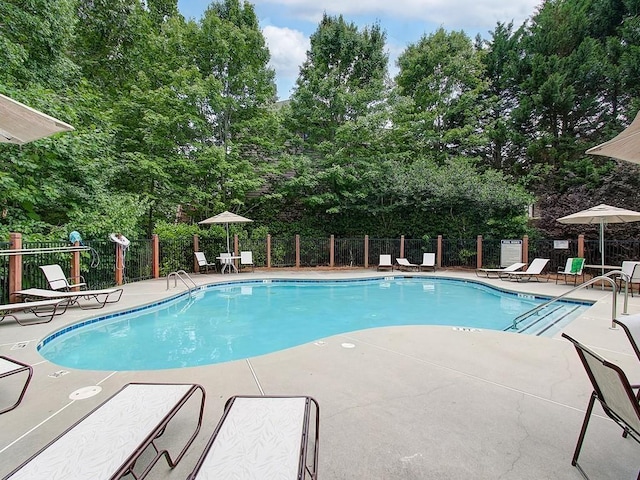 view of swimming pool featuring a patio area