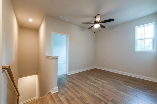 138 Henley St, Canton, GA 30114 - unfurnished room with wood finished floors, ceiling fan, baseboards, and recessed lighting