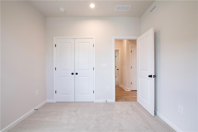 138 Henley St, Canton, GA 30114 - unfurnished bedroom with light carpet, baseboards, a closet, and recessed lighting