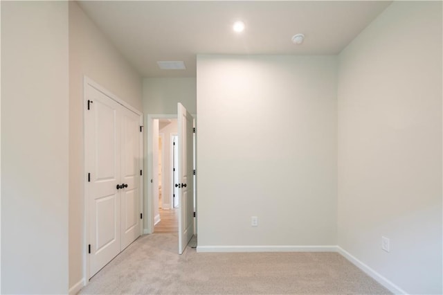 138 Henley St, Canton, GA 30114 - unfurnished bedroom featuring light colored carpet, baseboards, and a closet