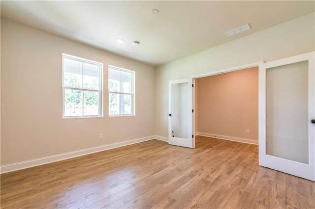 138 Henley St, Canton, GA 30114 - unfurnished bedroom with baseboards and light wood-style flooring