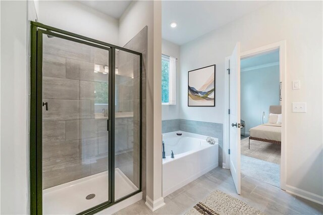 138 Henley St, Canton, GA 30114 - full bathroom with french doors, a garden tub, ensuite bathroom, a stall shower, and baseboards