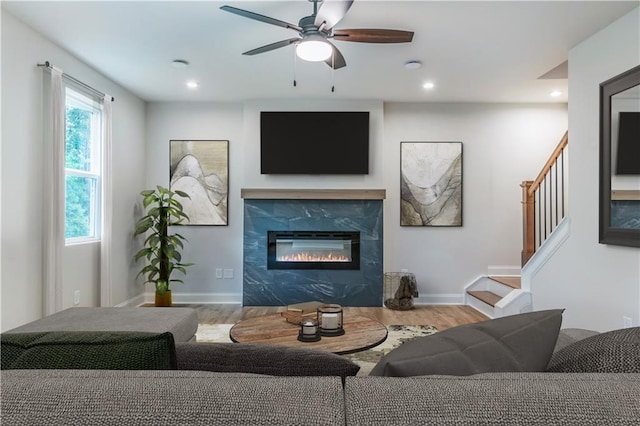 138 Henley St, Canton, GA 30114 - living room with wood finished floors, recessed lighting, stairway, a ceiling fan, and a high end fireplace