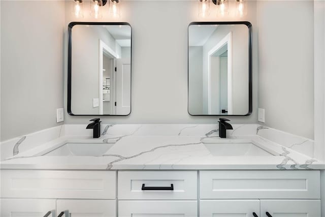 full bath featuring a sink and double vanity