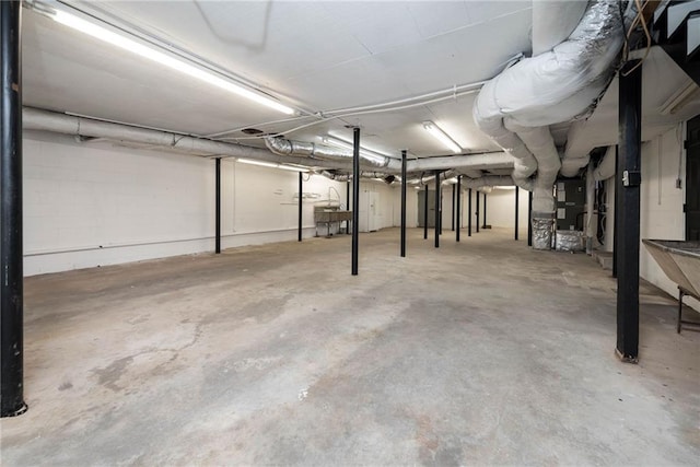 unfinished below grade area featuring heating unit