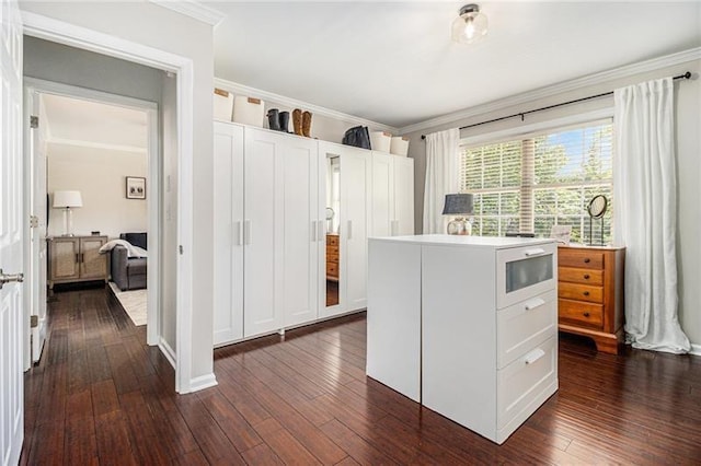 1175 Haven Brook Way, Atlanta, GA 30319 - kitchen with ornamental molding, dark wood-style flooring, white cabinets, light countertops, and a kitchen island