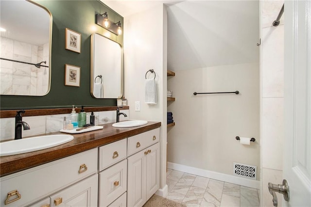 1175 Haven Brook Way, Atlanta, GA 30319 - bathroom with marble look tiles, double vanity, and a shower
