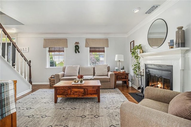 1175 Haven Brook Way, Atlanta, GA 30319 - living room with healthy amount of natural light, a fireplace with flush hearth, stairway, wood finished floors, and crown molding