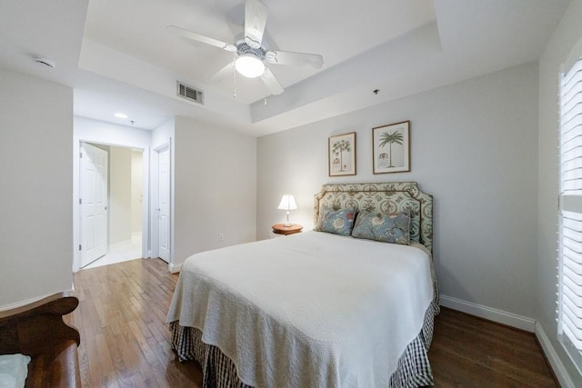 50 Biscayne Dr NW Unit 4110, Atlanta, GA 30309 - bedroom featuring a raised ceiling, wood finished floors, baseboards, ceiling fan, and recessed lighting