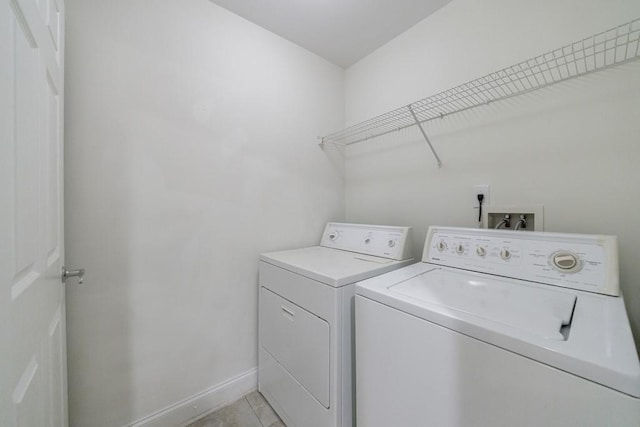 50 Biscayne Dr NW Unit 4110, Atlanta, GA 30309 - laundry room with separate washer and dryer, baseboards, and light tile patterned floors