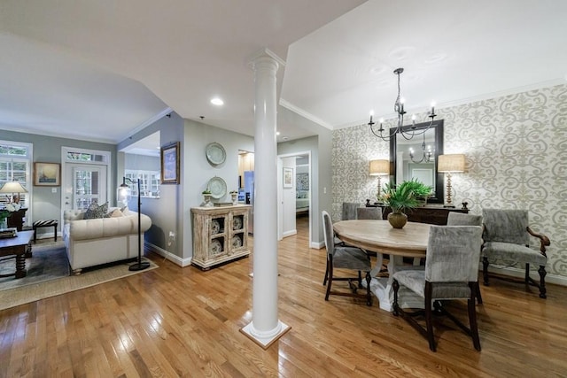 50 Biscayne Dr NW Unit 4110, Atlanta, GA 30309 - dining room featuring wallpapered walls, baseboards, crown molding, ornate columns, and wood finished floors