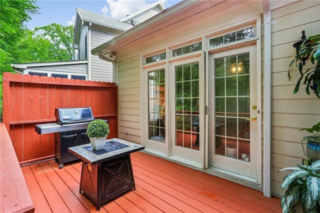 wooden terrace featuring area for grilling