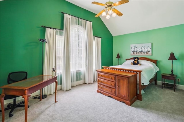 bedroom with ceiling fan, carpet flooring, vaulted ceiling, and multiple windows
