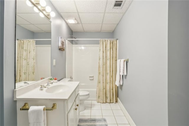 full bath with visible vents, shower / bath combo with shower curtain, tile patterned floors, vanity, and a paneled ceiling