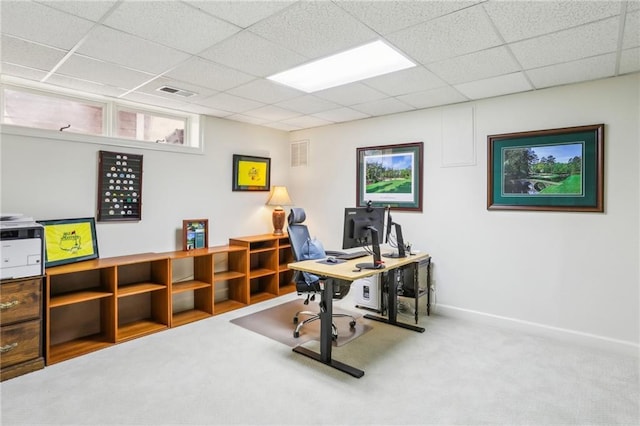 carpeted home office with visible vents and a paneled ceiling