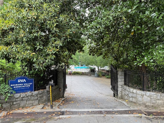 view of gate featuring fence
