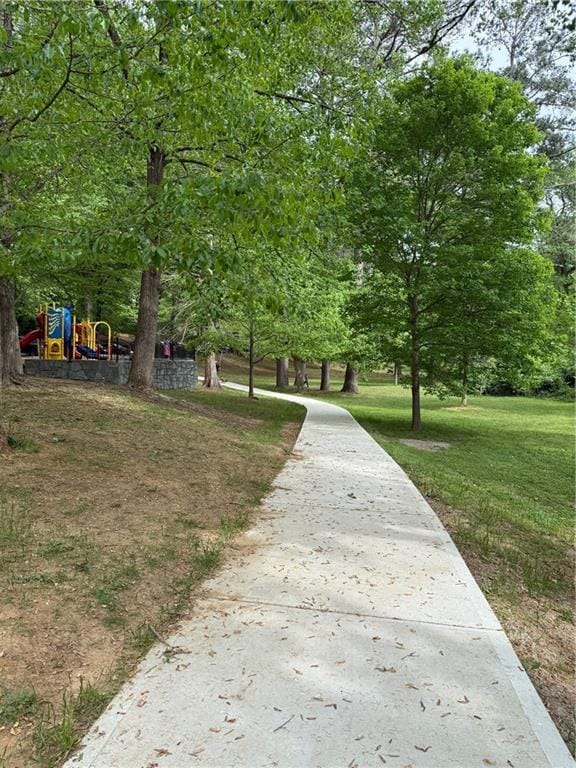view of home's community with a lawn