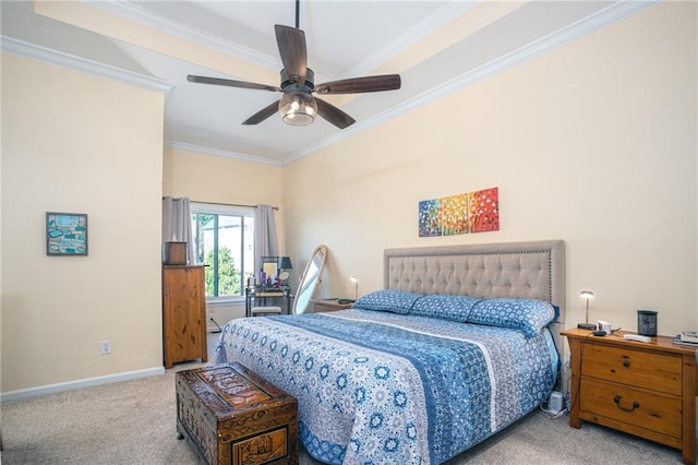 carpeted bedroom with baseboards, ornamental molding, and a ceiling fan