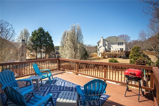 wooden terrace featuring area for grilling