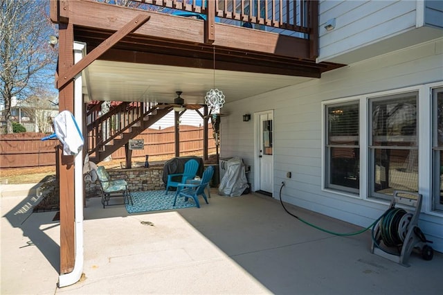 view of patio / terrace with stairs and fence