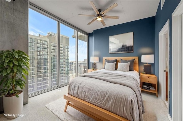 855 Peachtree St NE Unit 2713, Atlanta, GA 30308 - carpeted bedroom featuring a wall of windows, a city view, a ceiling fan, and access to exterior