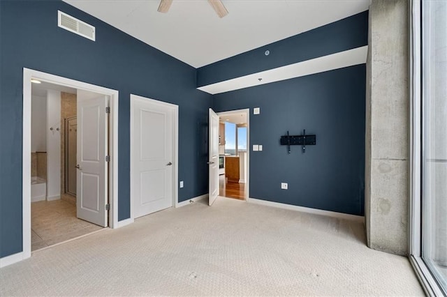 855 Peachtree St NE Unit 2713, Atlanta, GA 30308 - unfurnished bedroom featuring visible vents, baseboards, a ceiling fan, carpet, and ensuite bath