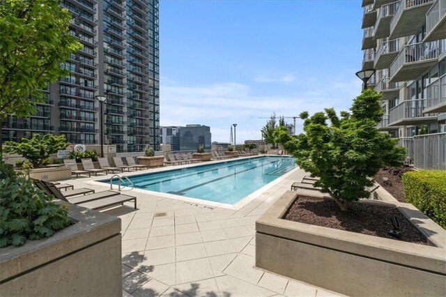 855 Peachtree St NE Unit 2713, Atlanta, GA 30308 - community pool featuring a patio