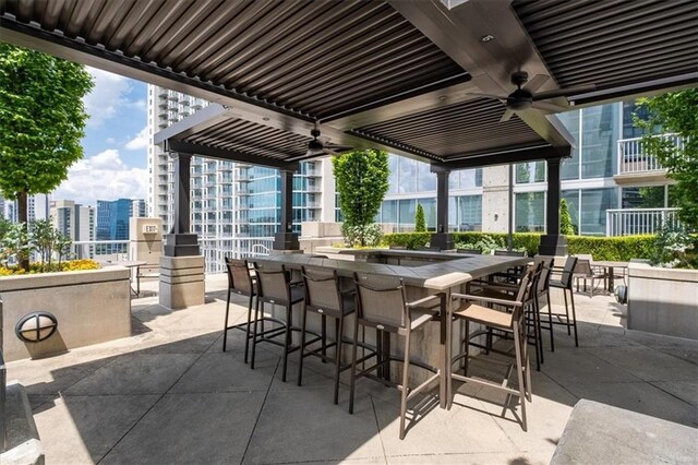 855 Peachtree St NE Unit 2713, Atlanta, GA 30308 - view of patio / terrace with a view of city, a ceiling fan, and outdoor dry bar