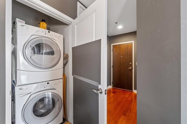 855 Peachtree St NE Unit 2713, Atlanta, GA 30308 - laundry area with laundry area, stacked washer and dryer, and wood finished floors