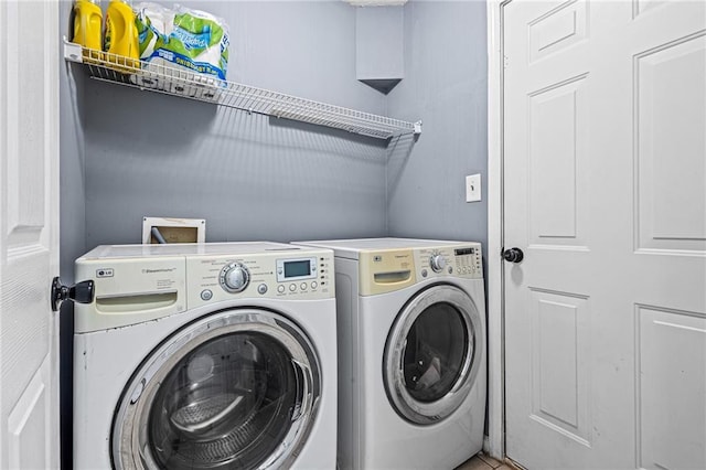 clothes washing area with independent washer and dryer