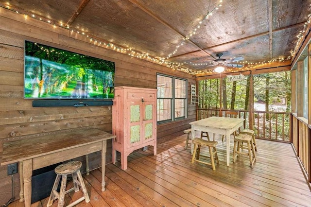 sunroom / solarium featuring wooden ceiling and ceiling fan